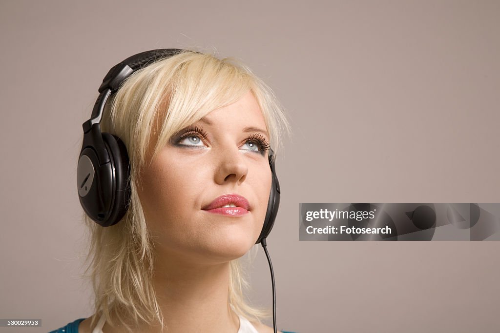 Young woman with headphones on