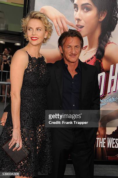 Actors Charlize Theron and Sean Penn arrive at the premiere of "A Million Ways To Die In The West" held at the Regency Theater in Westwood.