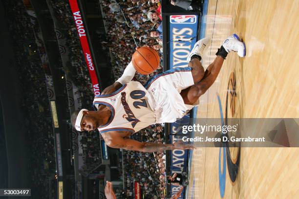 Larry Hughes of the Washington Wizards moves the ball against the Miami Heat in Game four of the Eastern Conference Semifinals during the 2005 NBA...