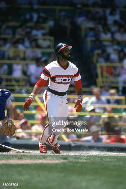 Harold Baines of the Chicago White Sox watches the flight of the ball during a season game. Harold Baines played for the Chicago White Sox from...