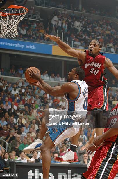 Gilbert Arenas of the Washington Wizards shoots against Udonis Haslem of the Miami Heat in Game four of the Eastern Conference Semifinals during the...