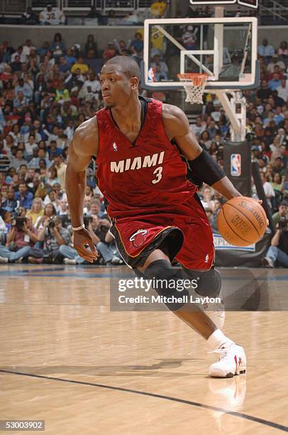 Dwyane Wade of the Miami Heat moves the ball against the Washington Wizards in Game four of the Eastern Conference Semifinals during the 2005 NBA...