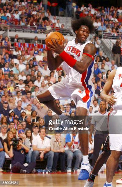 Ben Wallace of the Detroit Pistons rebounds against the Miami Heat in Game four of the Eastern Conference Finals during the 2005 NBA Playoffs on May...