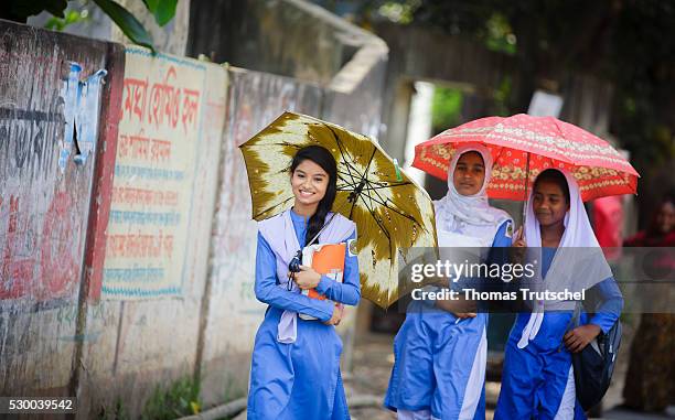 Savar, Bangladesh Girls in school uniform walking along a road after school on April 13, 2016 in Savar, Bangladesh.