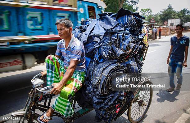 Savar, Bangladesh A man transported jeans on a rickshaw on April 13, 2016 in Savar, Bangladesh.
