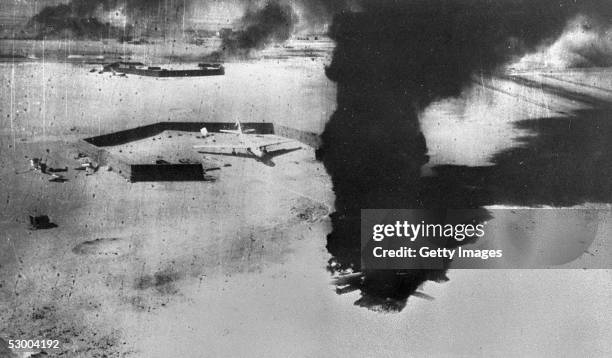Smoke rises from destroyed Egyptian airplanes during an Israeli Air Force preemptive strike June 5, 1967 against Egyptian airfields at the start of...