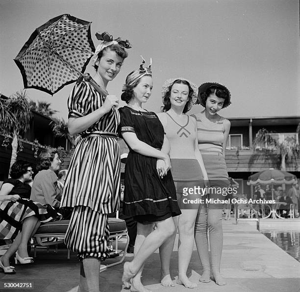 The Sennett Bathing Beauties pose by a swimming pool in Los Angeles,CA.
