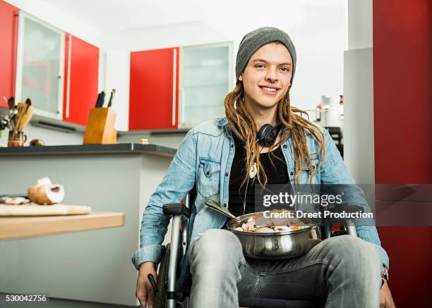 young man with raw chicken in the pan, munich, bavaria, germany - 19 years old dinner stock pictures, royalty-free photos & images