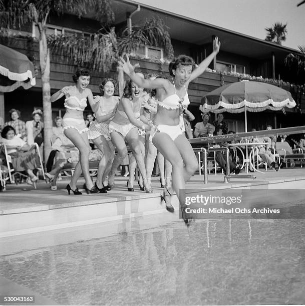 Sennett Bathing Beauties jump in a swimming pool in Los Angeles,CA.
