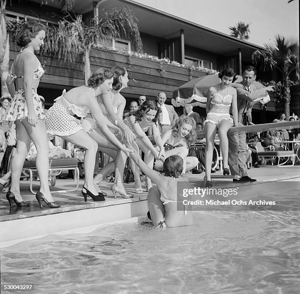Sennett Bathing Beauties pose by the swimming pool in Los Angeles,CA.