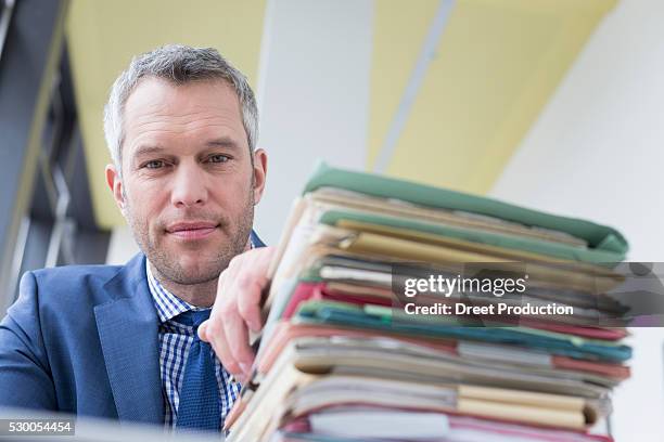 businessman working in office, leipzig, saxony, germany - ordner büro stock pictures, royalty-free photos & images