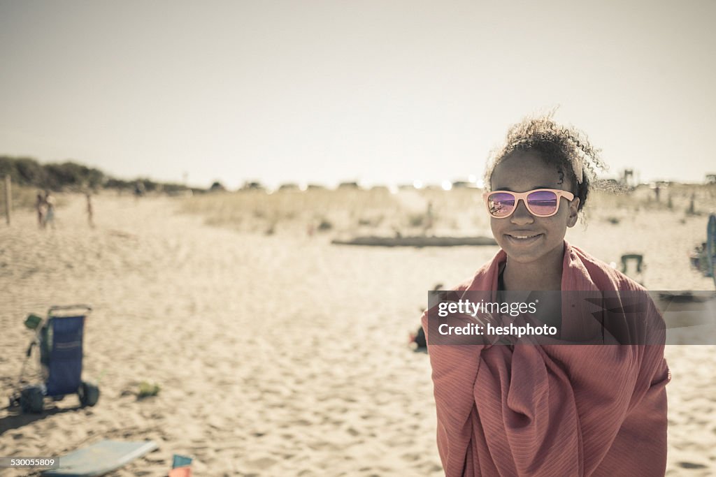 Girl wrapped in towel on beach, Truro, Massachusetts, Cape Cod, USA