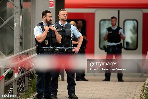 Riot police secures the crime scene after a deadly knife attack on May 10, 2016 in Grafing, Bavaria. One person has died and three others have been...