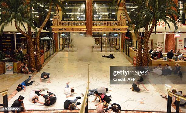 Simulation of the moment a suicide bomber detonates an explosive inside a shopping centre in Manchester, north west England on May 10, 2016. Police...