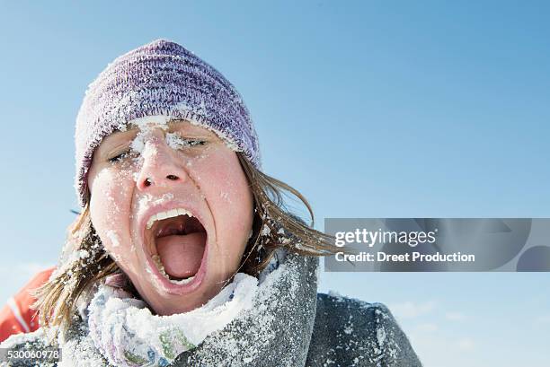 woman hit by snowball, bavaria, germany - face snow stock pictures, royalty-free photos & images