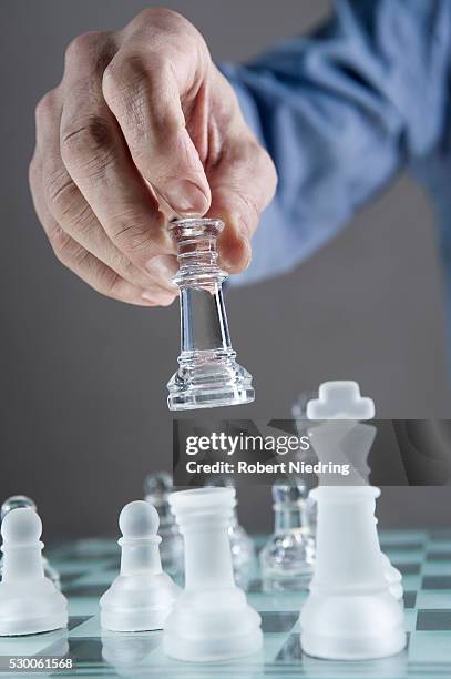 close-up of man's hand going for checkmate while playing chess, bavaria, germany - schach matt stock-fotos und bilder