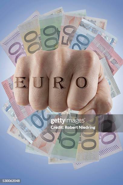 close-up of fist with text "euro" on it, bavaria, germany - two hundred euro banknote stock pictures, royalty-free photos & images