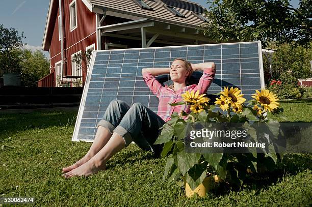 garden woman relaxing solar panel sleeping - tall blonde women stock pictures, royalty-free photos & images