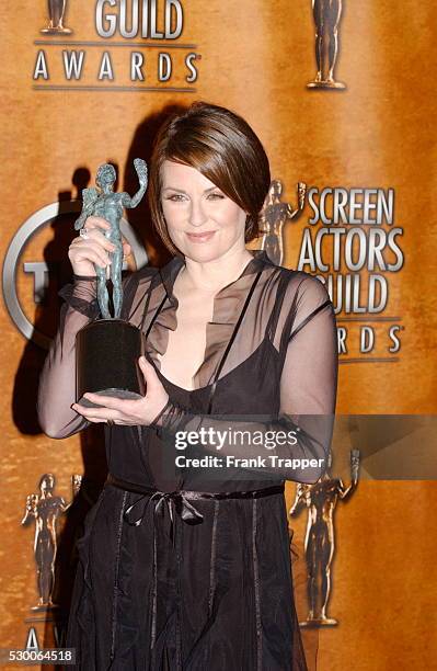 Megan Mullally in the press room with her award for Best Actress in a Comedy Series at the 10th Annual Screen Actors Guild Awards.