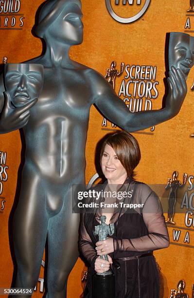 Megan Mullally in the press room with her award for Best Actress in a Comedy Series at the 10th Annual Screen Actors Guild Awards.