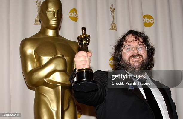 Director Peter Jackson in the press room with one of his awards at the 76th Annual Academy Awards.