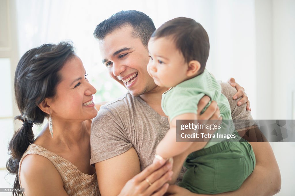 USA, New Jersey, Jersey City, Family with baby son (6-11 months) in bedroom