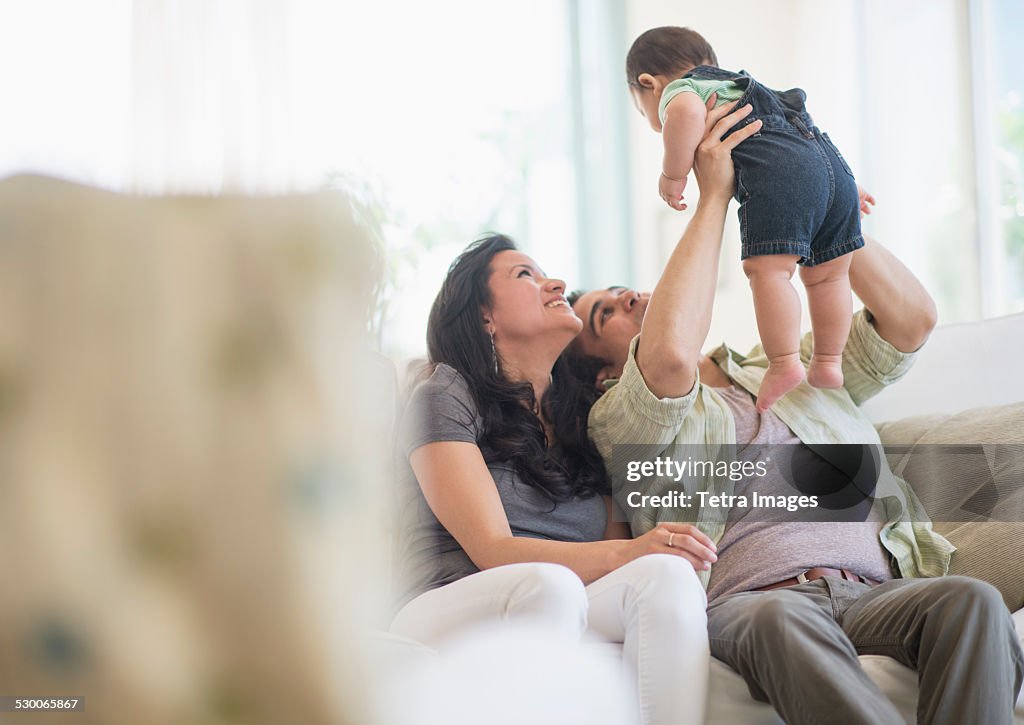 USA, New Jersey, Jersey City, Family with baby son (6-11 months) in living room