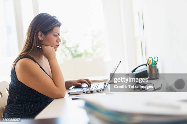 usa, new jersey, woman working in home office - profile laptop sitting stock pictures, royalty-free photos & images