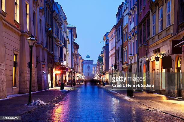 poland, cracow, dusk view of florianska street - krakow stock pictures, royalty-free photos & images