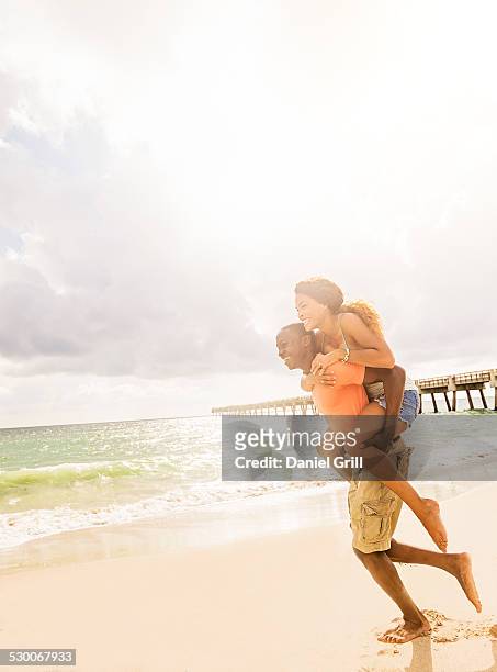 usa, florida, jupiter, young couple playing on beach - footsteps on a boardwalk bildbanksfoton och bilder