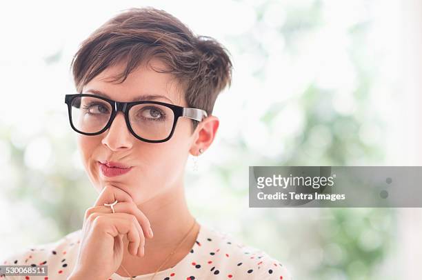 usa, new jersey, jersey city, portrait of smiling woman wearing eyeglasses - hand on chin thinking stock pictures, royalty-free photos & images