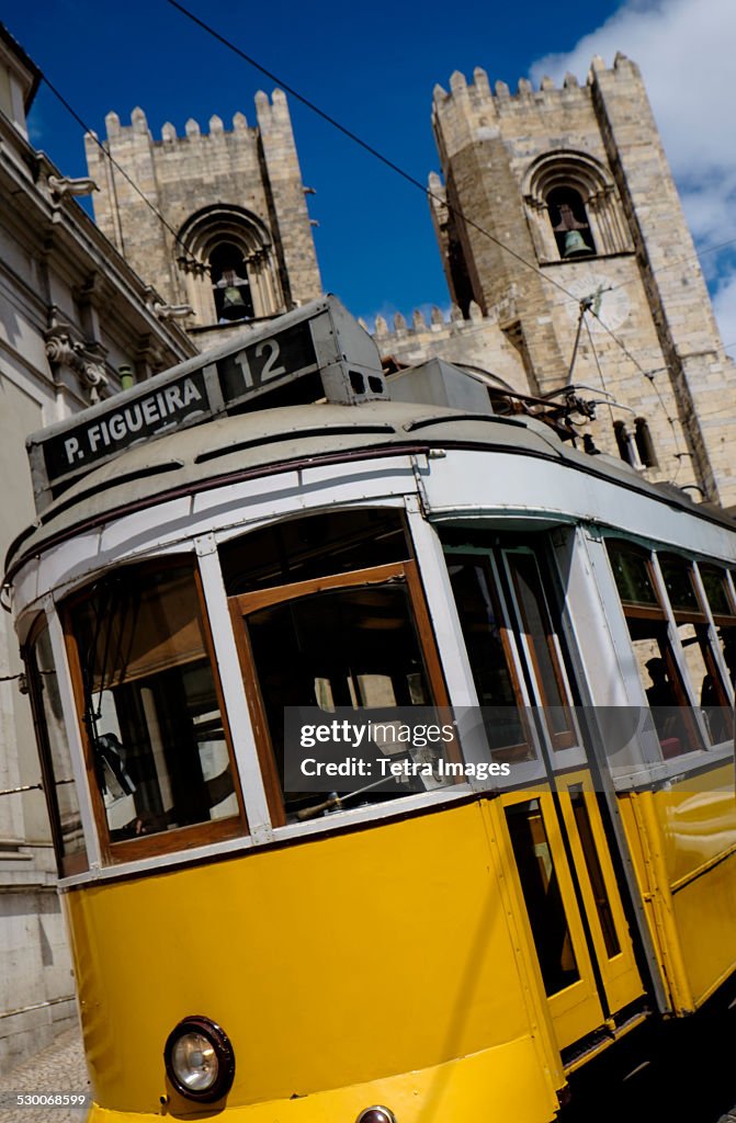 Portugal, Lisbon, Tram in front of Lisbon Cathedral