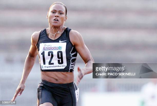 Athlete Marion Jones competes in the 100 m during the second edition of the IAAF Grand Prix II in Milan 01 June 2005. Three-time Olympic champion...