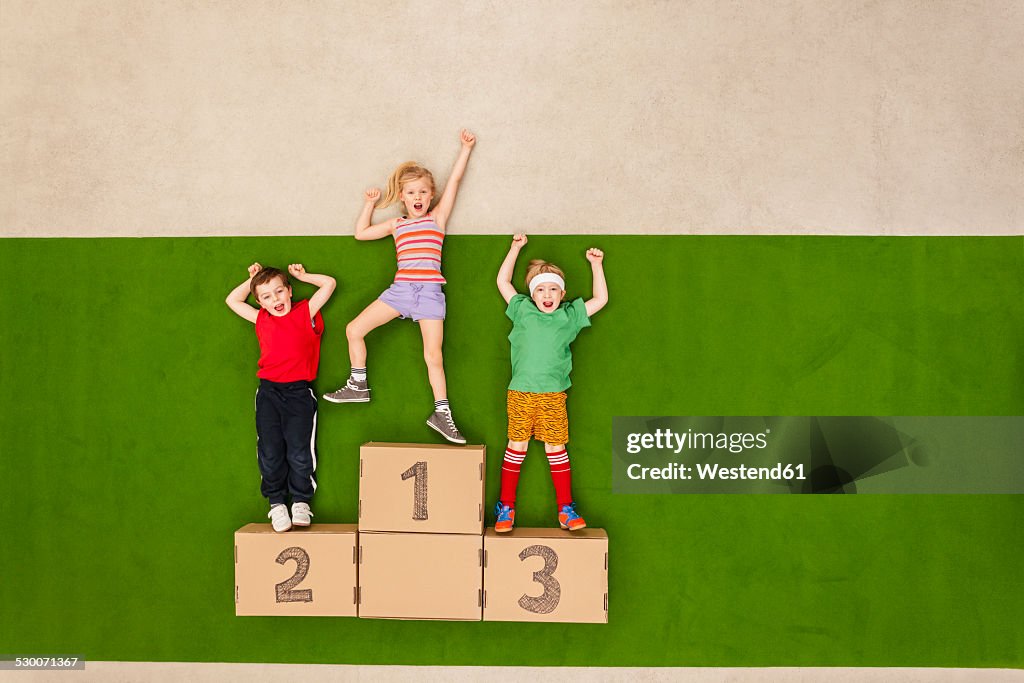 Children standing on podium