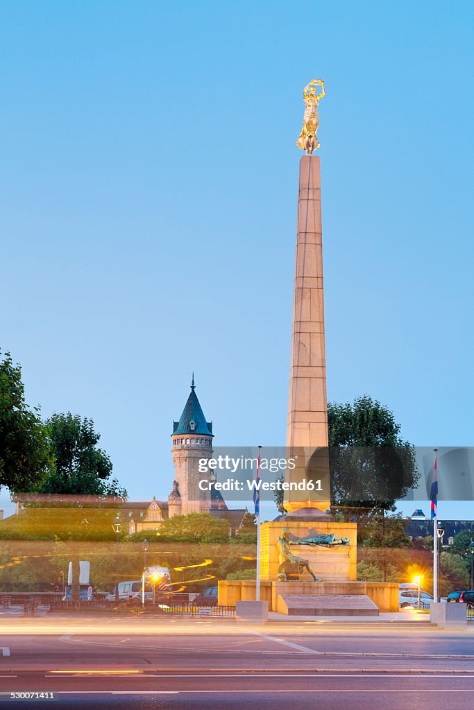 Luxembourg, Luxembourg City, Monument Gelle Fra at the Place de la Constitution, Tower of Museé de la Banque in the background, morning light