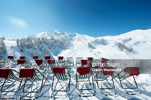 austria, salzburg state, altenmarkt-zauchensee, row of deckcairs in alpine landscape - däcksstol bildbanksfoton och bilder