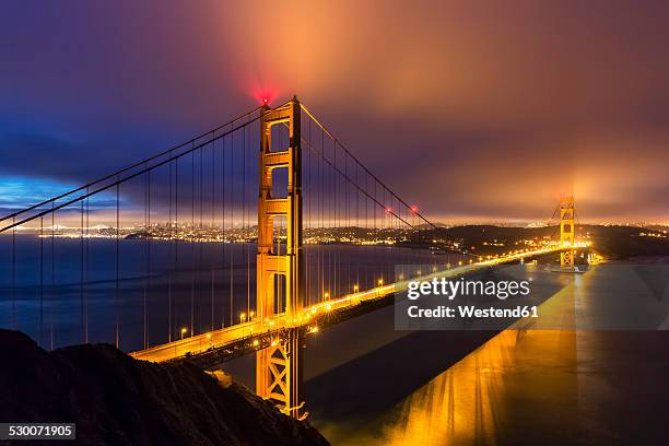 usa, california, san francisco, skyline and golden gate bridge at the blue hour seen from hawk hill - golden gate bridge night stock pictures, royalty-free photos & images