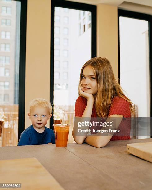 Russian supermodel Natalia Vodianova at the kitchen counter inside her New York City home with her son, Lucas.