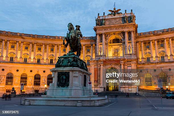 austria, vienna, view to lighted hofburg palace at twilight - city break stock pictures, royalty-free photos & images
