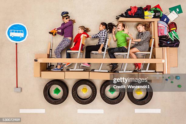 school children in school bus - kids sitting together in bus stock pictures, royalty-free photos & images