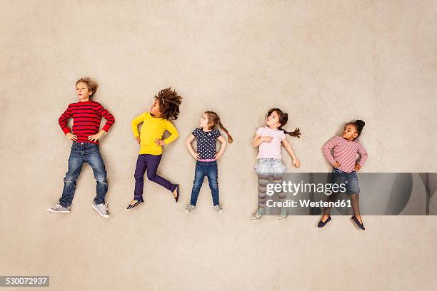 children standing with hands on hips - five people stock pictures, royalty-free photos & images