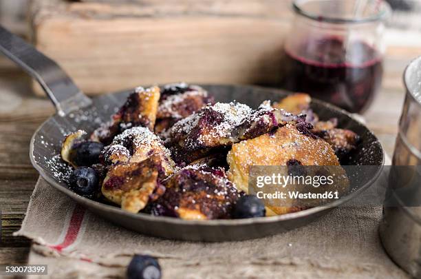 kaiserschmarren with blueberries - kaiserschmarrn stock pictures, royalty-free photos & images