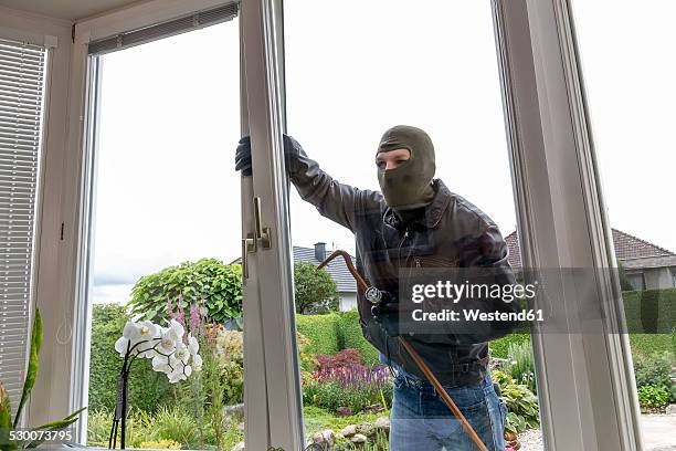 burglar trying to get into house - einbruch stock-fotos und bilder