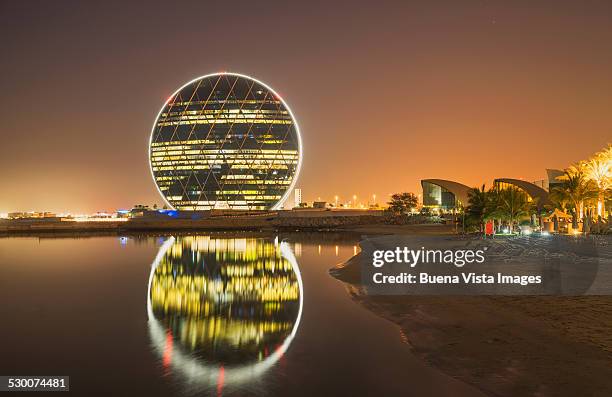 aldar  circular building in abu dhabi - aldar abu dhabi stock pictures, royalty-free photos & images