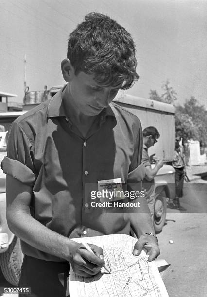 In this handout photo from the GPO, Israeli census taker Shlomo Passi checks his area map just three months after the 1967 Six-Day War, September 14...