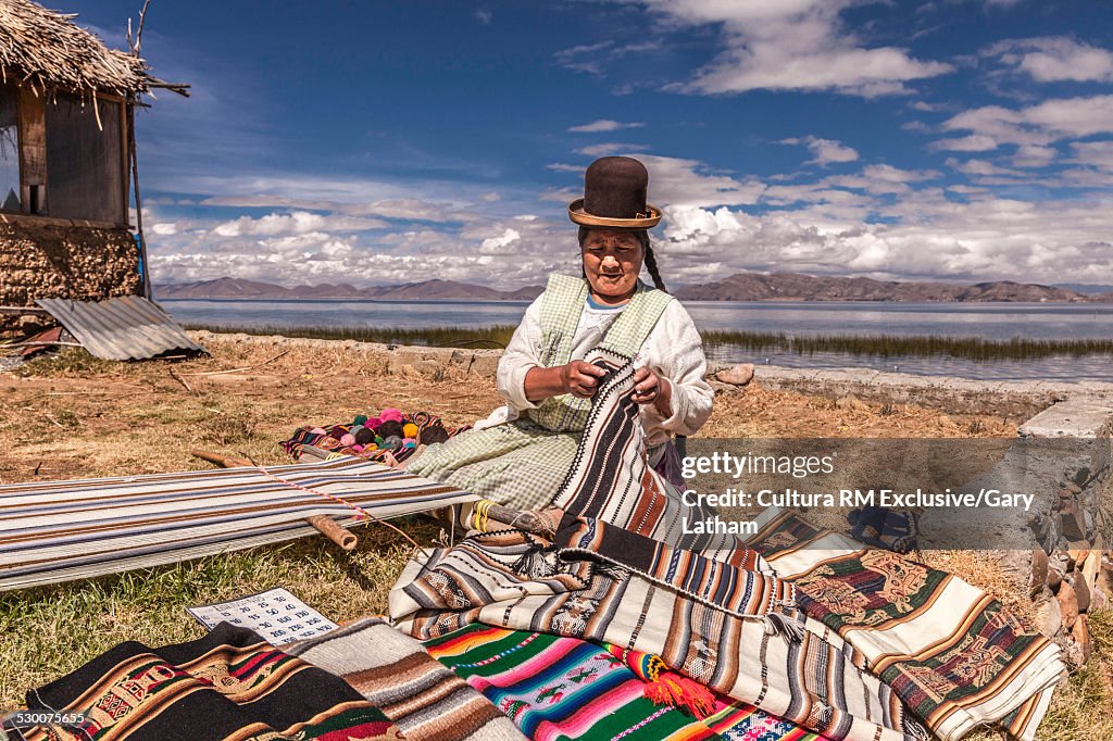 Quechua woman trading textiles, Lake Titicaca, Bolivia, South America