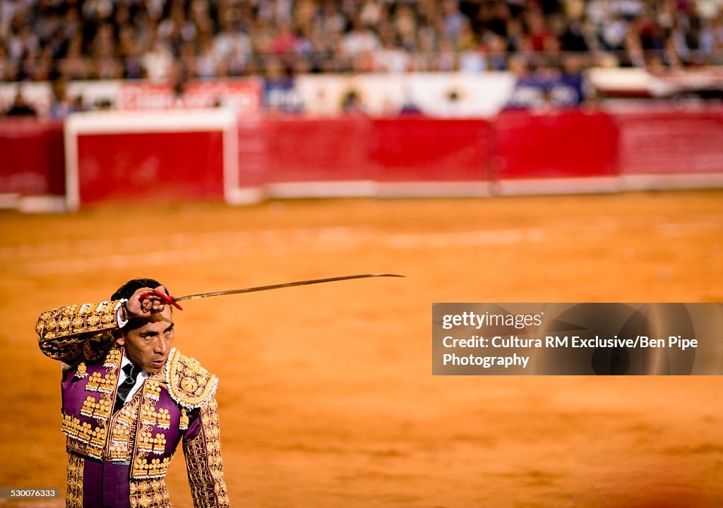 Bullfighter poised with sword, Plaza Mexico, Mexico City, Mexico