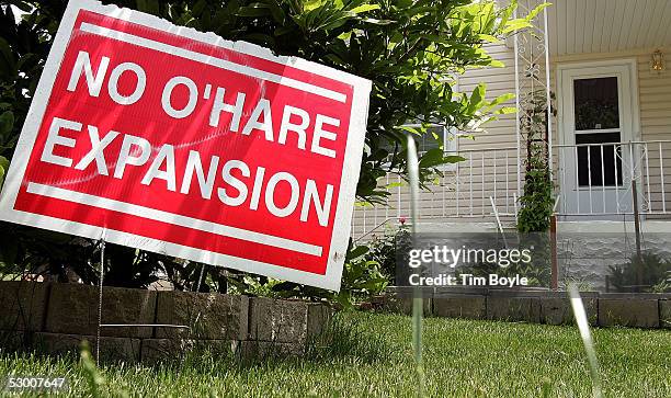 No O'Hare Expansion" sign is seen in front of a home near Chicago's O'Hare Airport June 1, 2005 in Bensenville, Illinois. Numerous acres of land and...