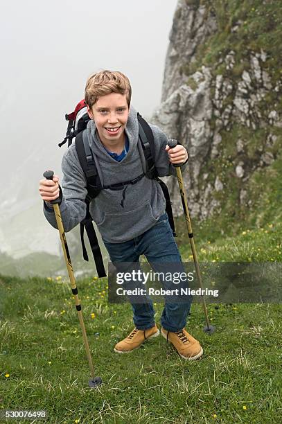 teenage boy hiking in mountains alps - high hills shoes stock pictures, royalty-free photos & images