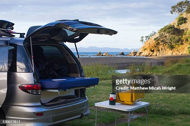 a beachfront campsite on the coromandel - coromandel stock pictures, royalty-free photos & images